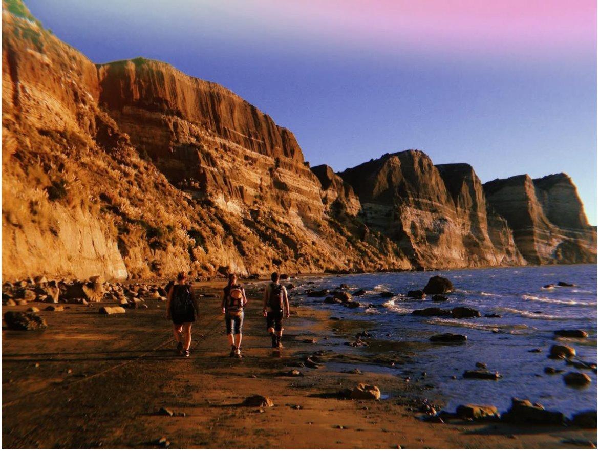 Layered coastal cliffs above the sea